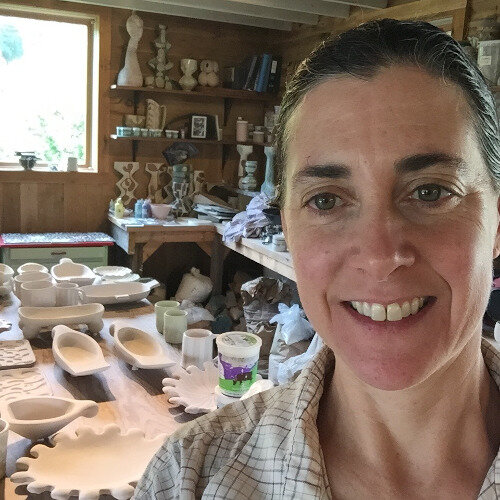 robbie in studio glazing.jpg