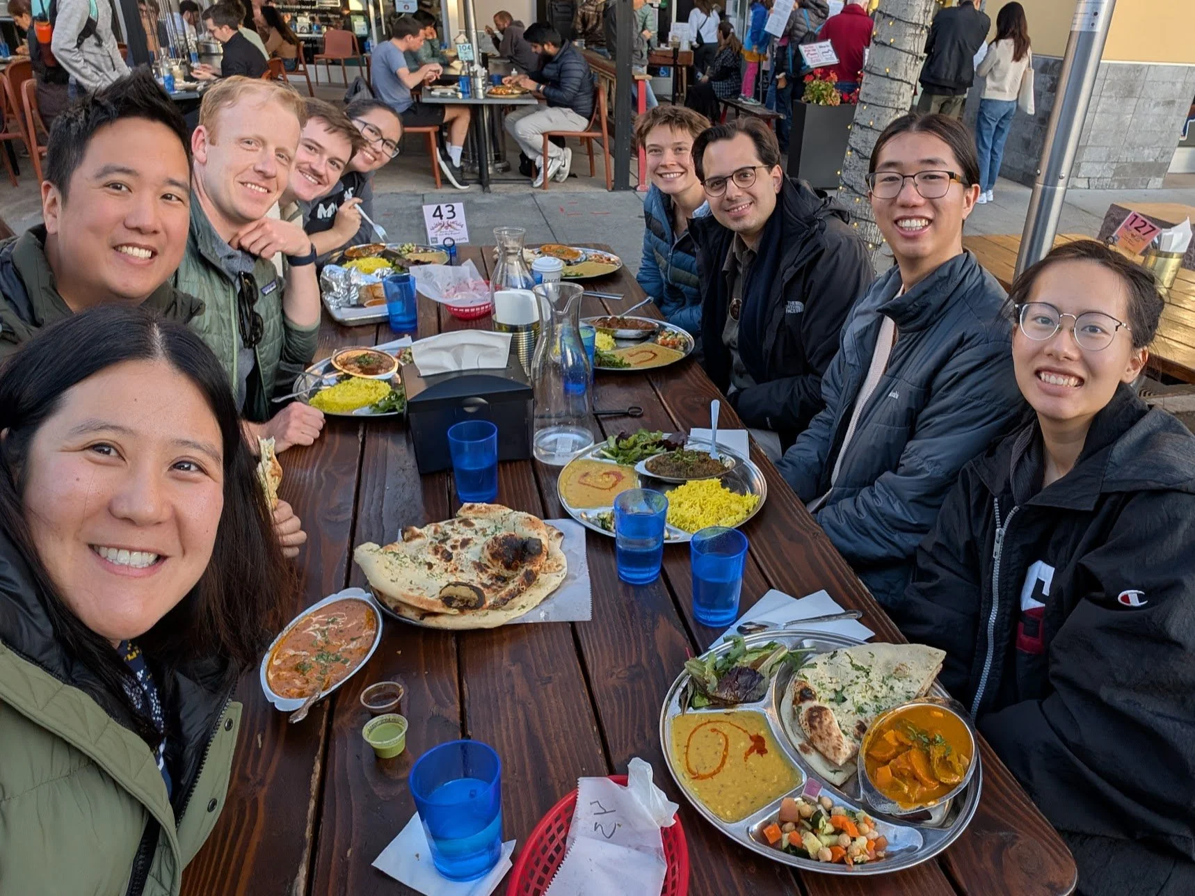 lab members at dinner with Dr. Bizan Balzer
