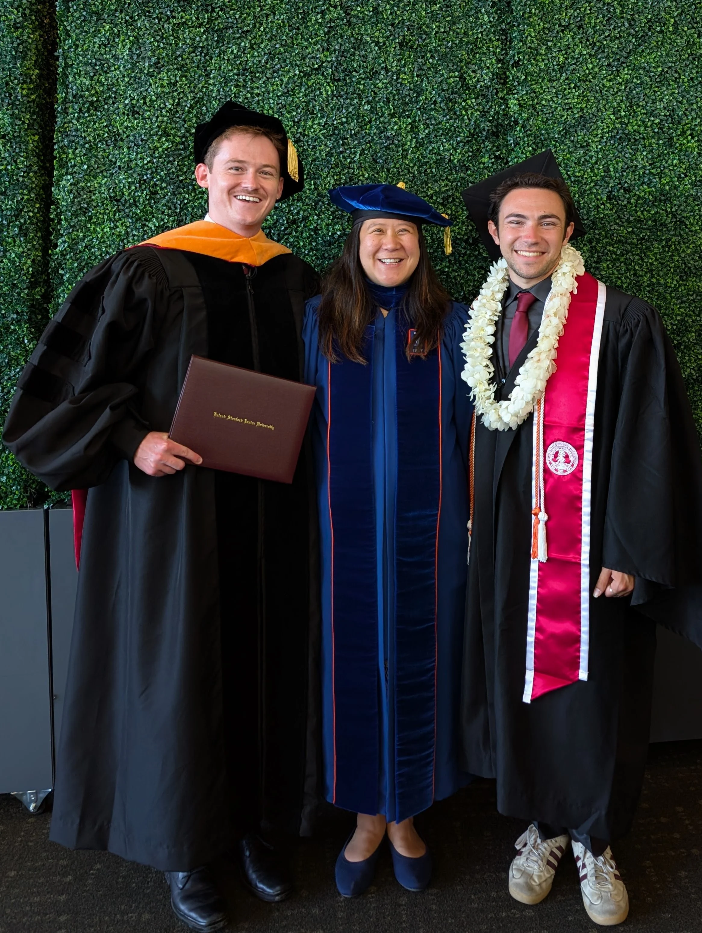 left-to-right: Brendan, Danielle, Jesse in graduation attire