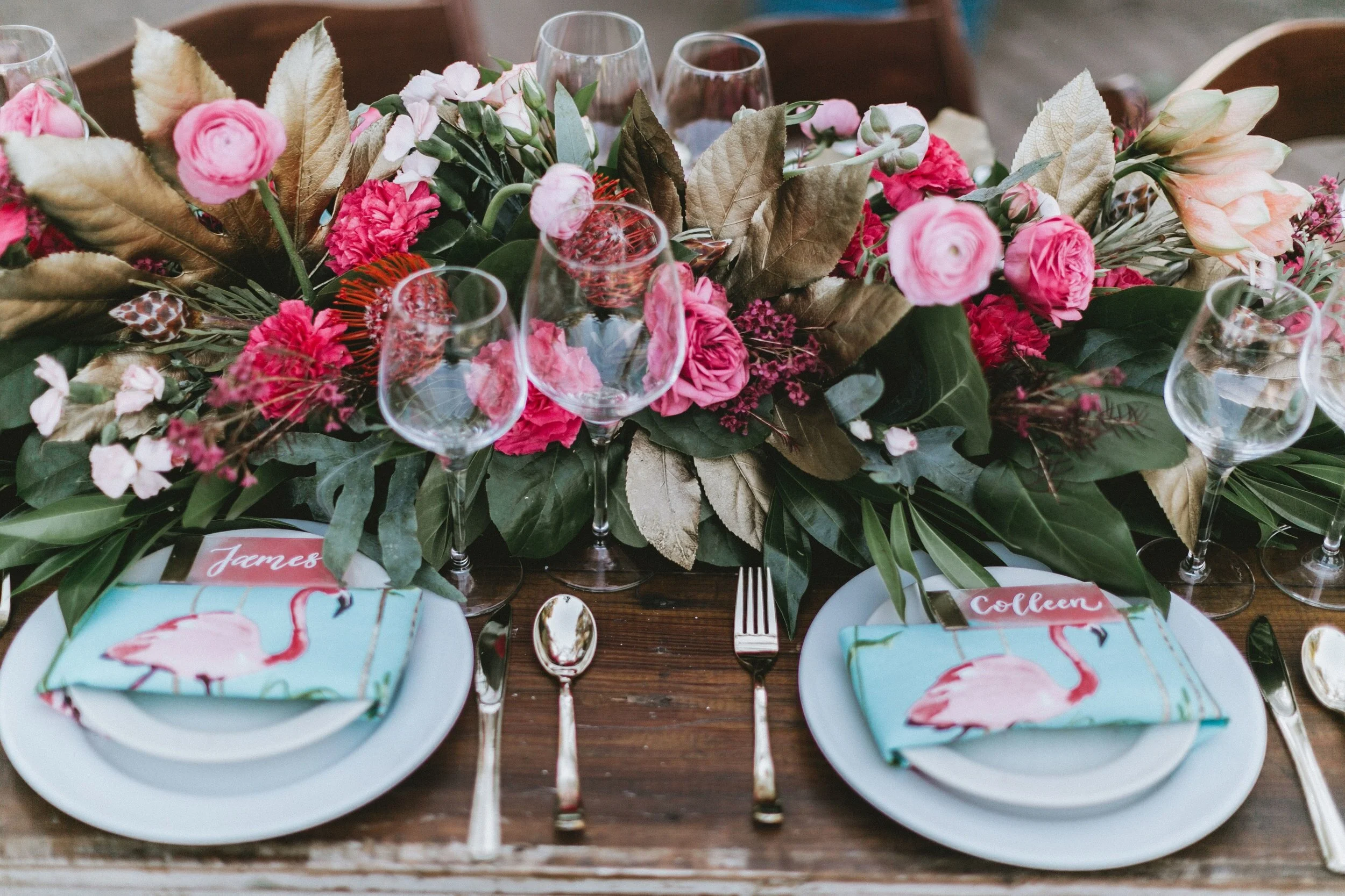 Bright pink florals are the perfect pair for this flamingo themed zoo wedding.