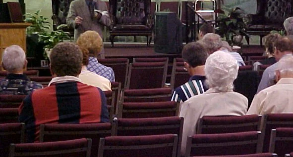 Richard teaching in a church.png