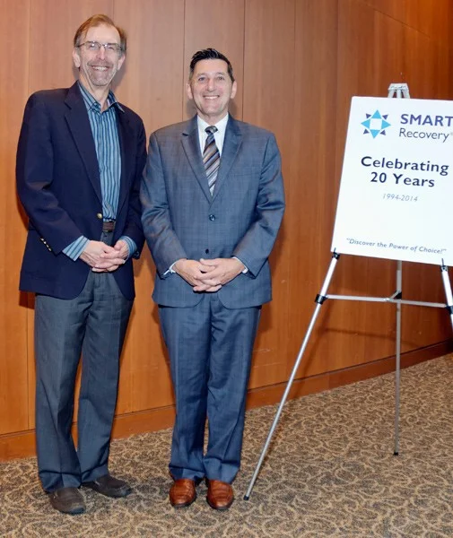 Former Director of the White House Office of National Drug Control Policy, Michael Bottecelli (right), presents an endorsement certificate to SMART Recovery USA board member, Tom Horvath at the SMART Recovery USA 20th Anniversary Conference in Washington. D.C., September 2015.