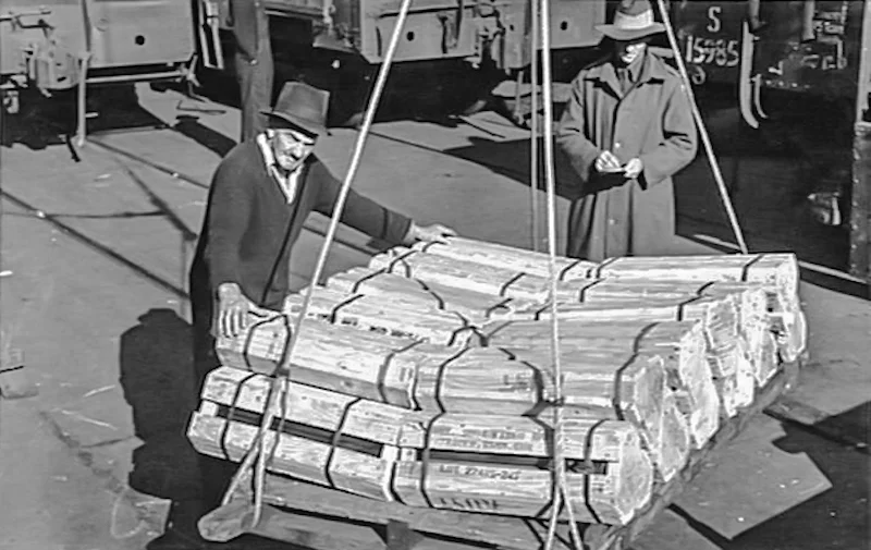 Tray of 75MM shells being lowered into ship M.V.Sarmiento Wharf 13 Pyrmont. June 1944