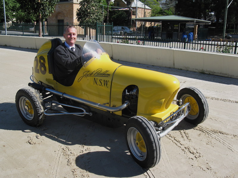Peter Mann, CEO Wentworth Park Sporting Complex, in Jack Brabham’s midget racing car