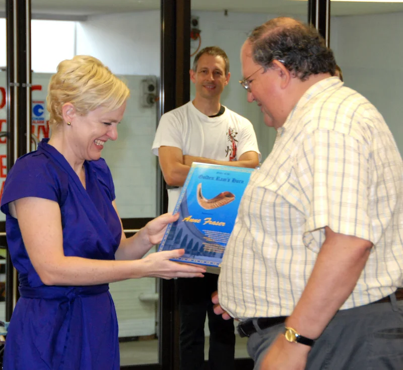 Simon Fraser accepts the award on behalf of Anne Fraser