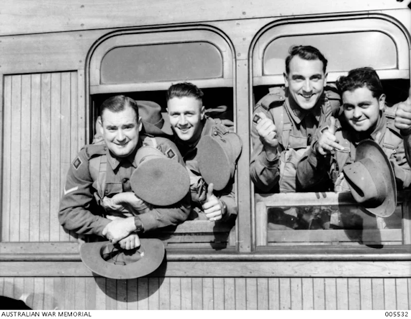 7th Div.arriving by train at Pyrmont wharf to depart on Queen Mary December 1940