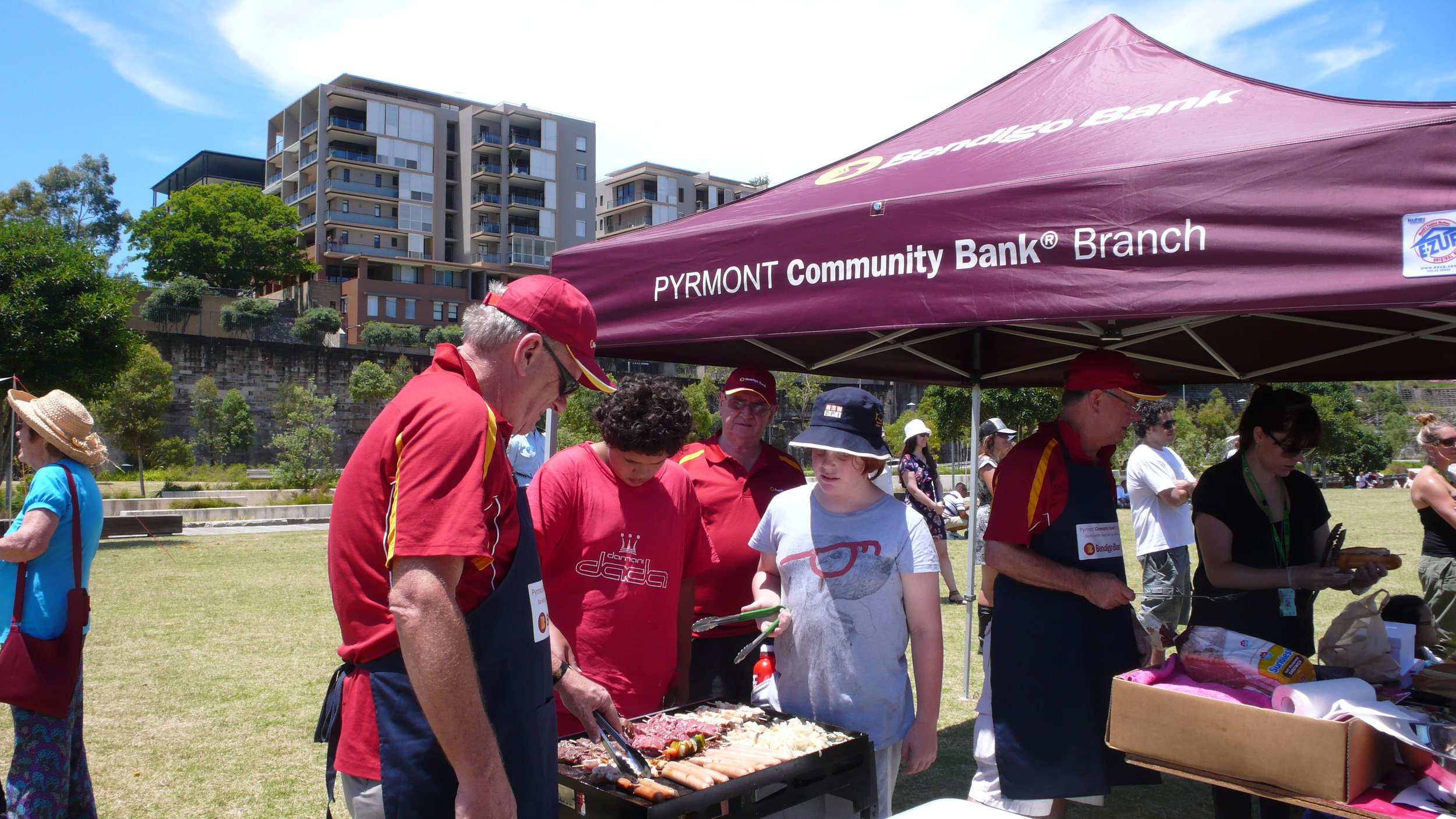 Pyrmont Community Bank Board teaching young people about sausage sizzles 2011