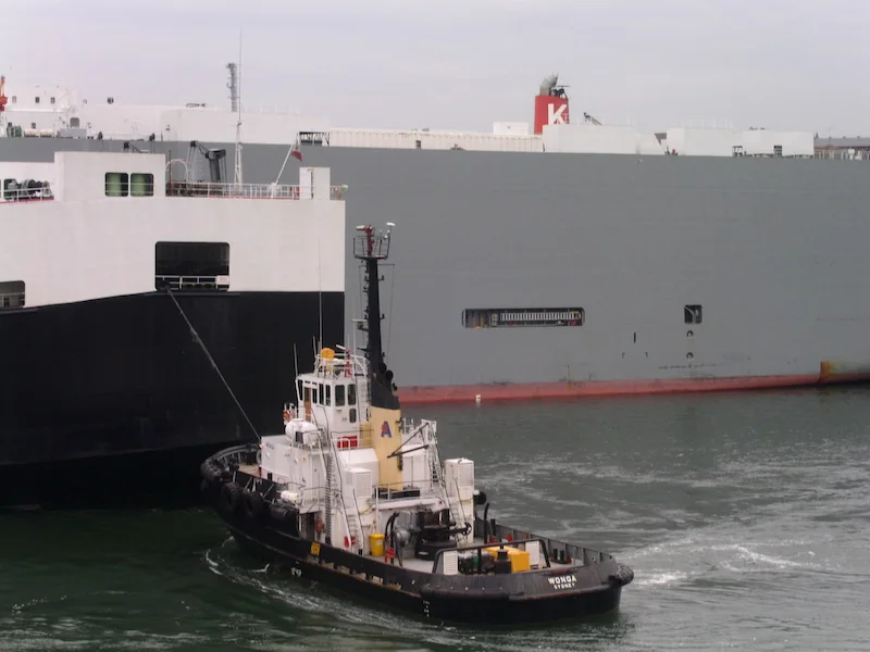Car ferry and tug