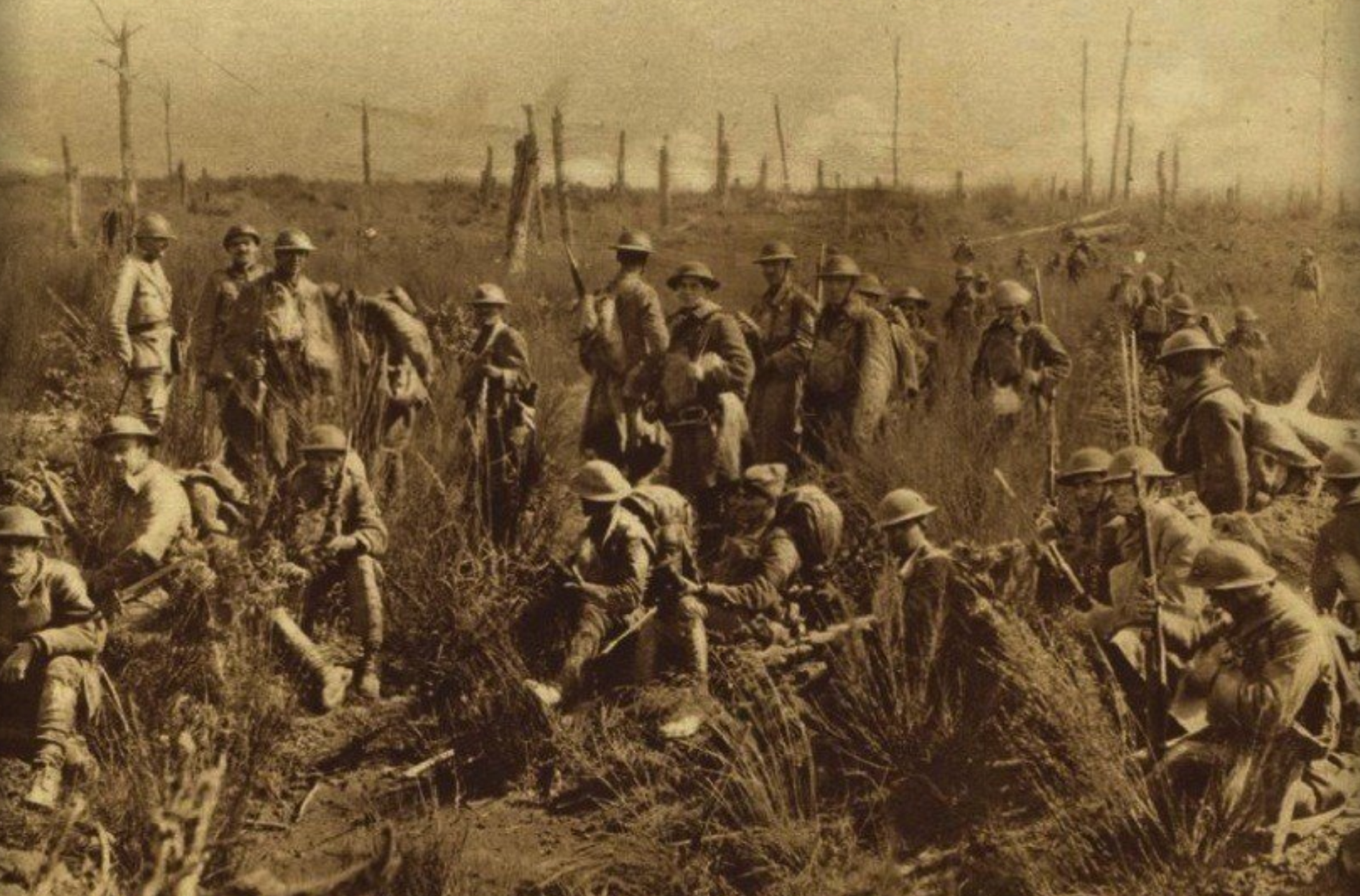 Soldiers pause for a Rest in a smouldering field