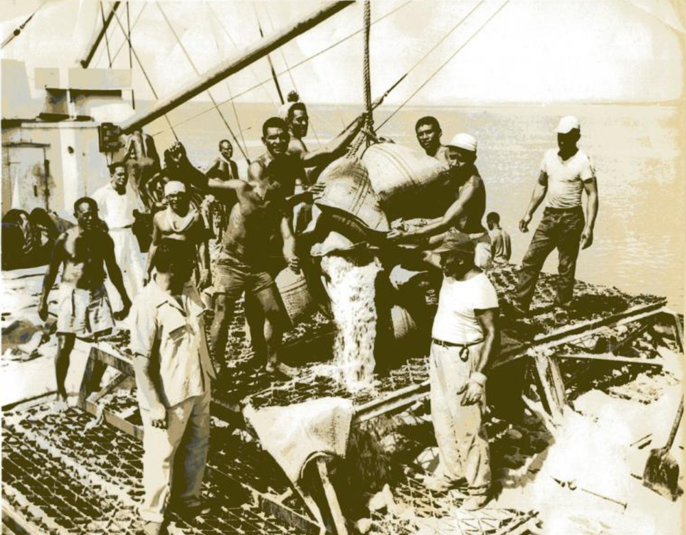 Wharf men loading the last sugar crushed at Nausori Mill before the mill closed on 7 January 1960