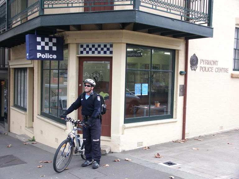 Police station with constable on bicycle