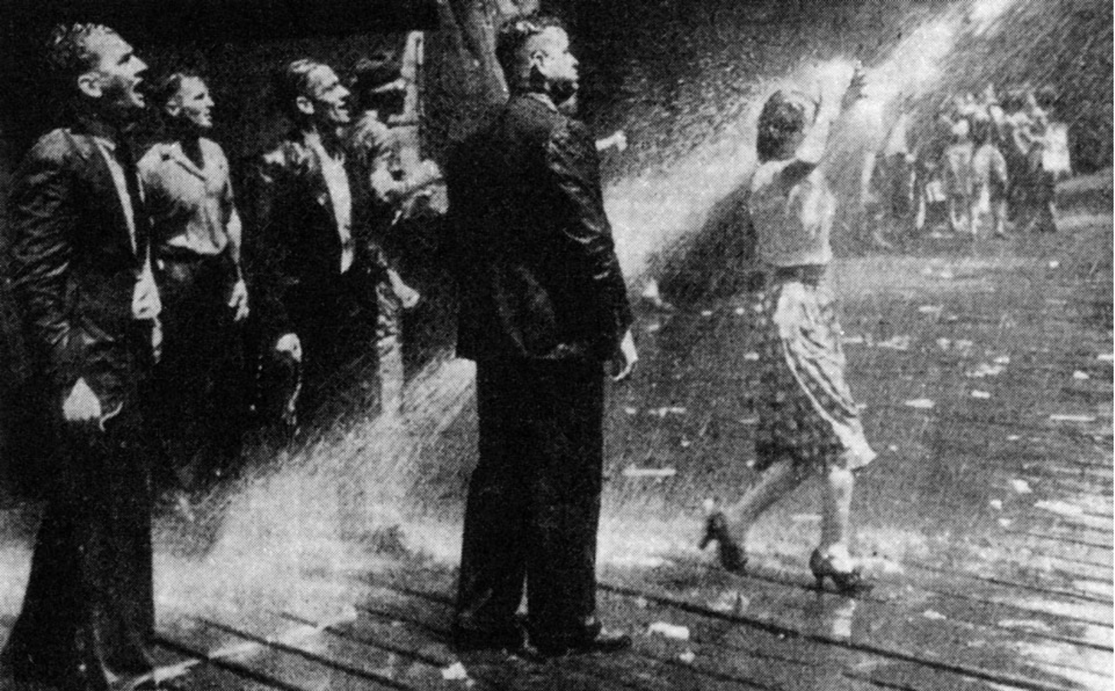 Protesters being hosed by Dutch troops aboard a British ship during a Sydney demonstration against the transport of Dutch military support to the Netherlands East Indies, 1945