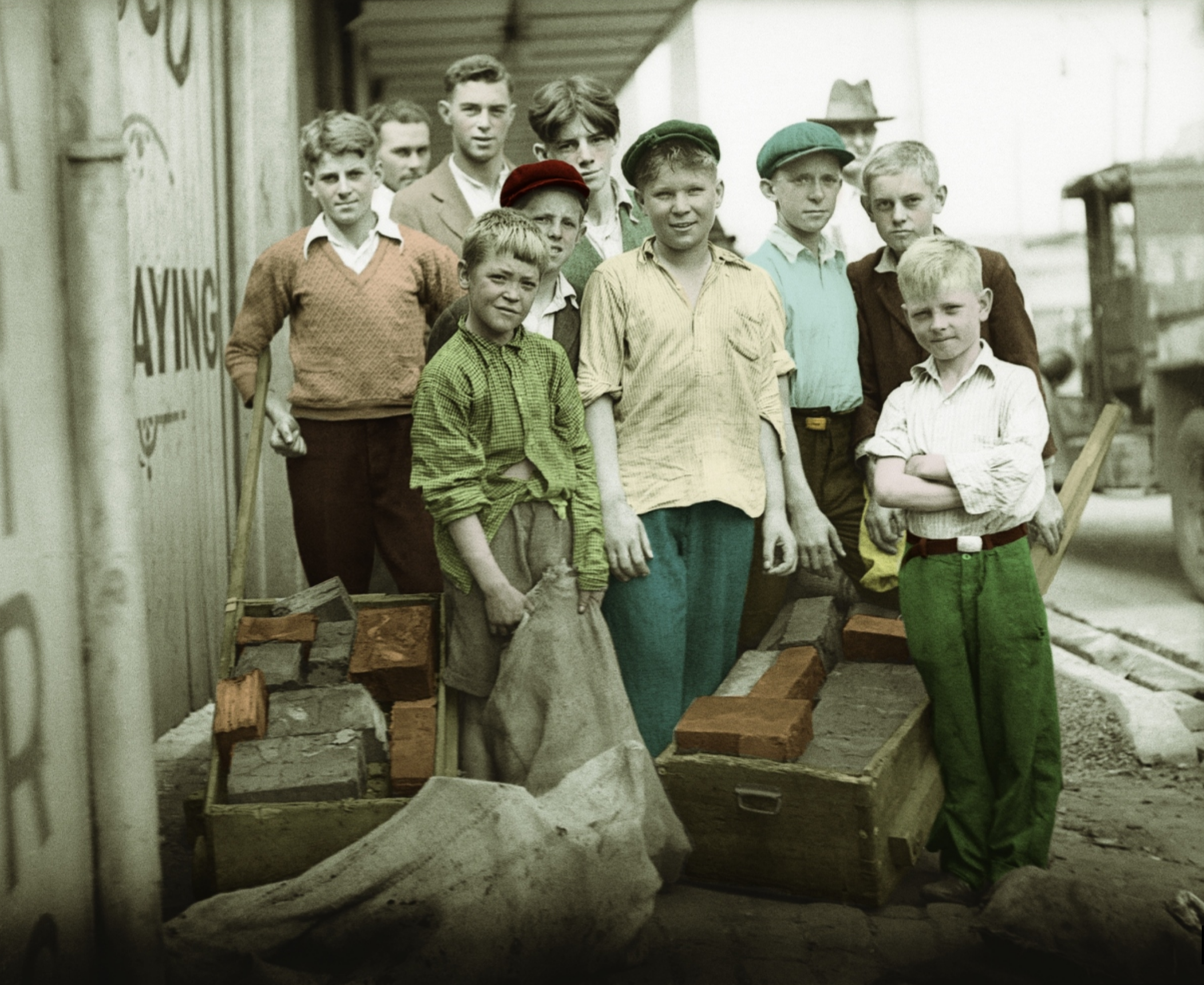 Men and boys collecting wood blocks