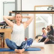 Pilates teacher in Surrey teaching a Pilates class