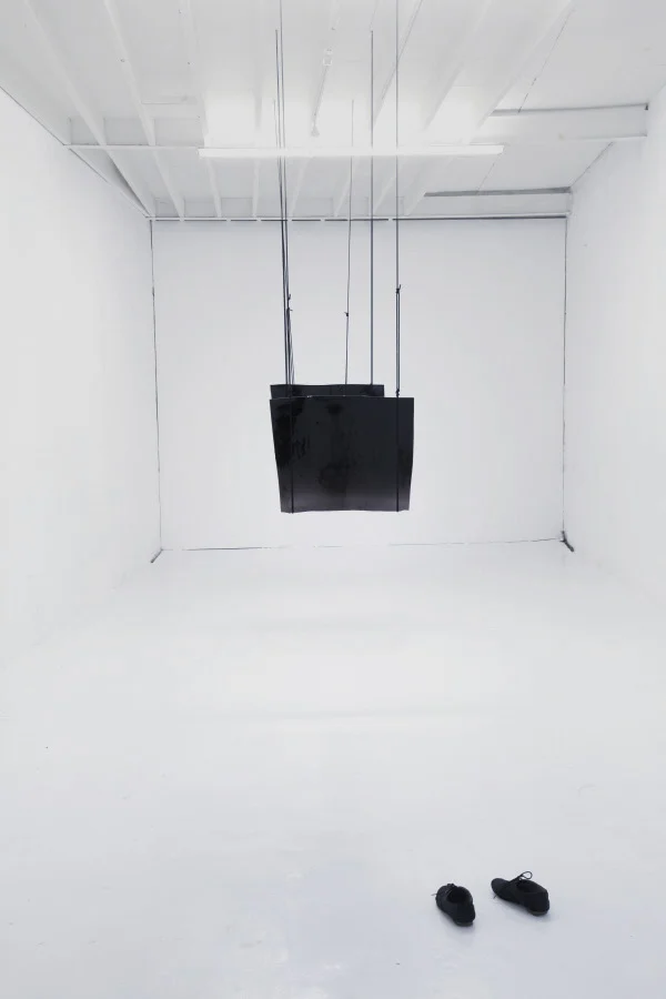 Existere at the Son Gallery, Installation photographs of hand blown sheets of black glass suspended from gallery ceilings, Son Gallery, 2011
