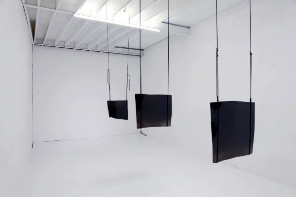 Existere at the Son Gallery, Installation photographs of hand blown sheets of black glass suspended from gallery ceilings, Son Gallery, 2011