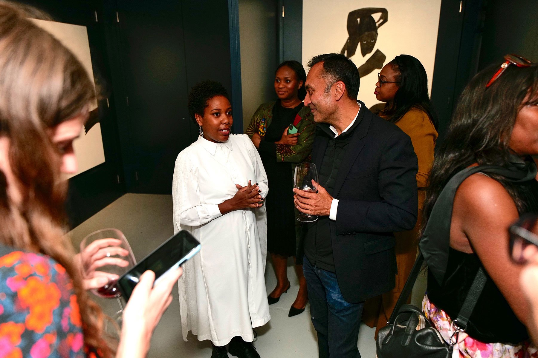 Sungi-Mlengeya-with-audience-at-her-inagural-solo-exhibition-that-marked-the-opening-of-the-Africa-Centre-in-Southwark-London.jpg