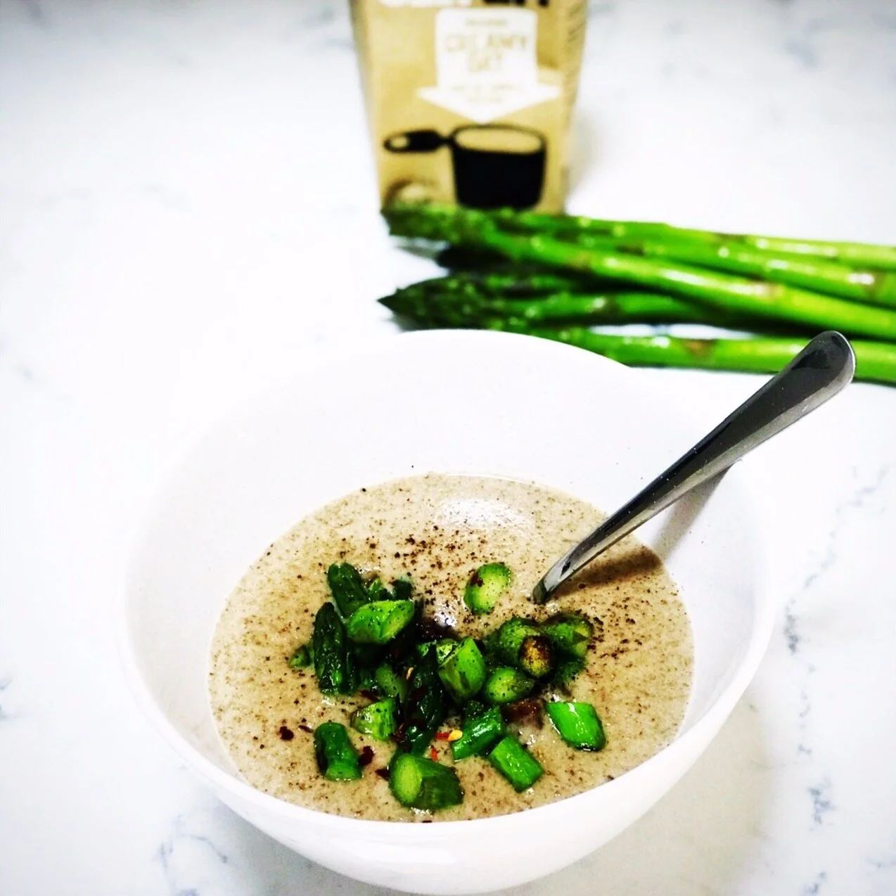 Portobello mushroom soup with sautéd green asparagus and truffle oil