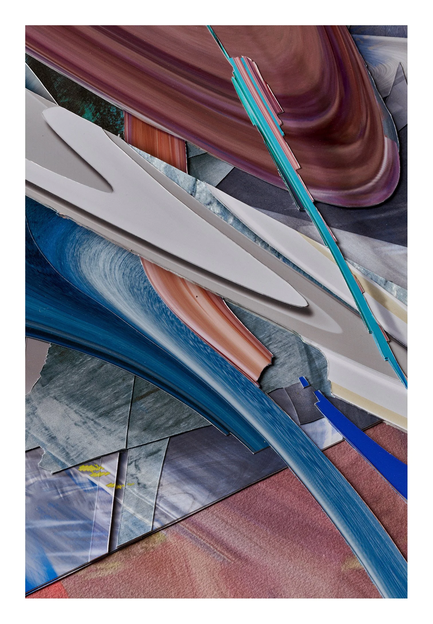 A pile of colorful, abstractly shaped materials with swirling patterns in shades of blue, red, purple, gray, and teal, layered and overlapping on a textured red surface.