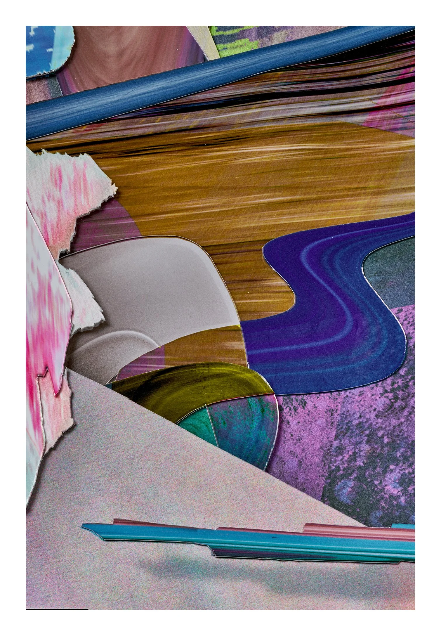 Close-up of torn, colorful pieces of paper and cardboard with a vibrant, abstract, mixed-media background.