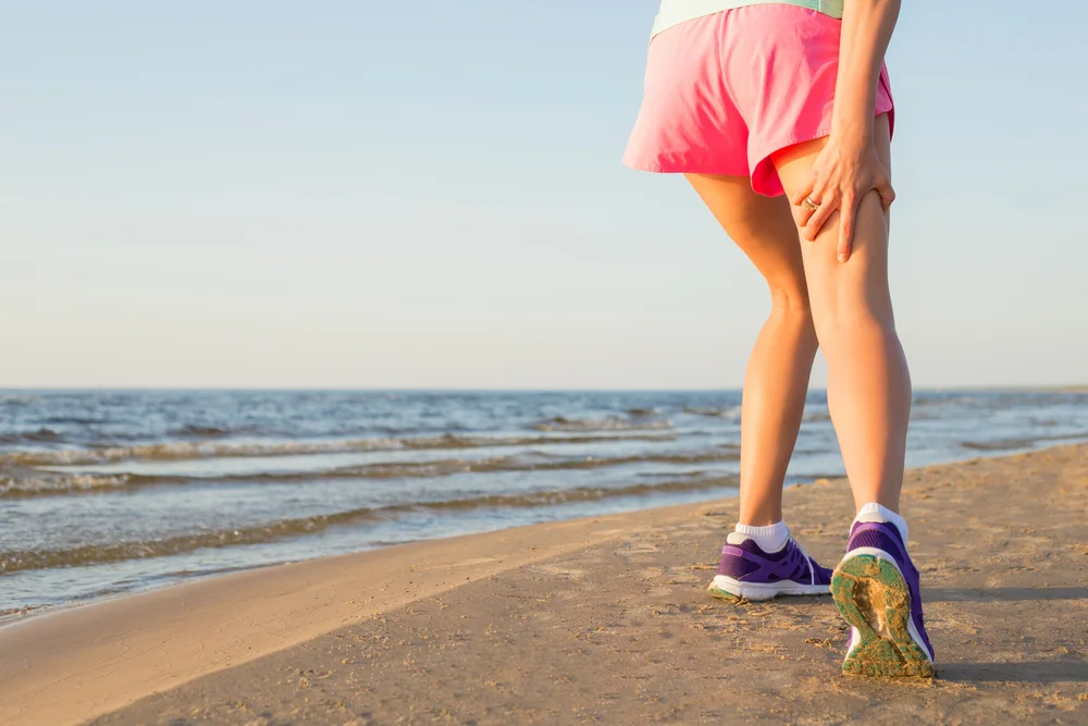 Female runner with pulled hamstring.jpg