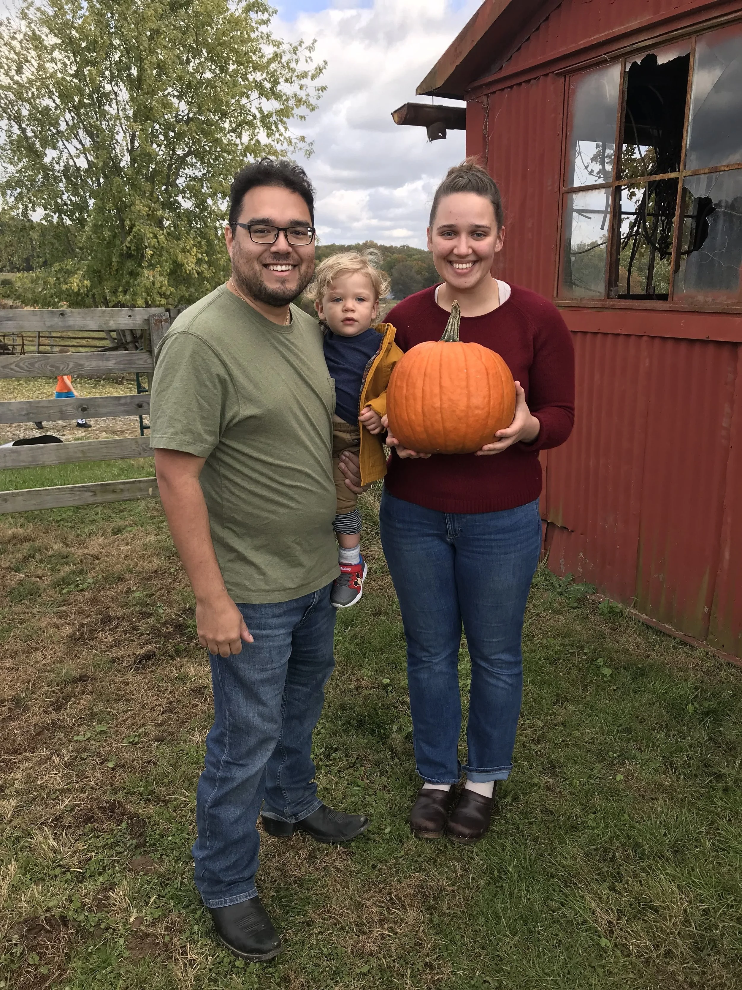 Picking up a pumpkin at Fowler Pumpkin Patch.