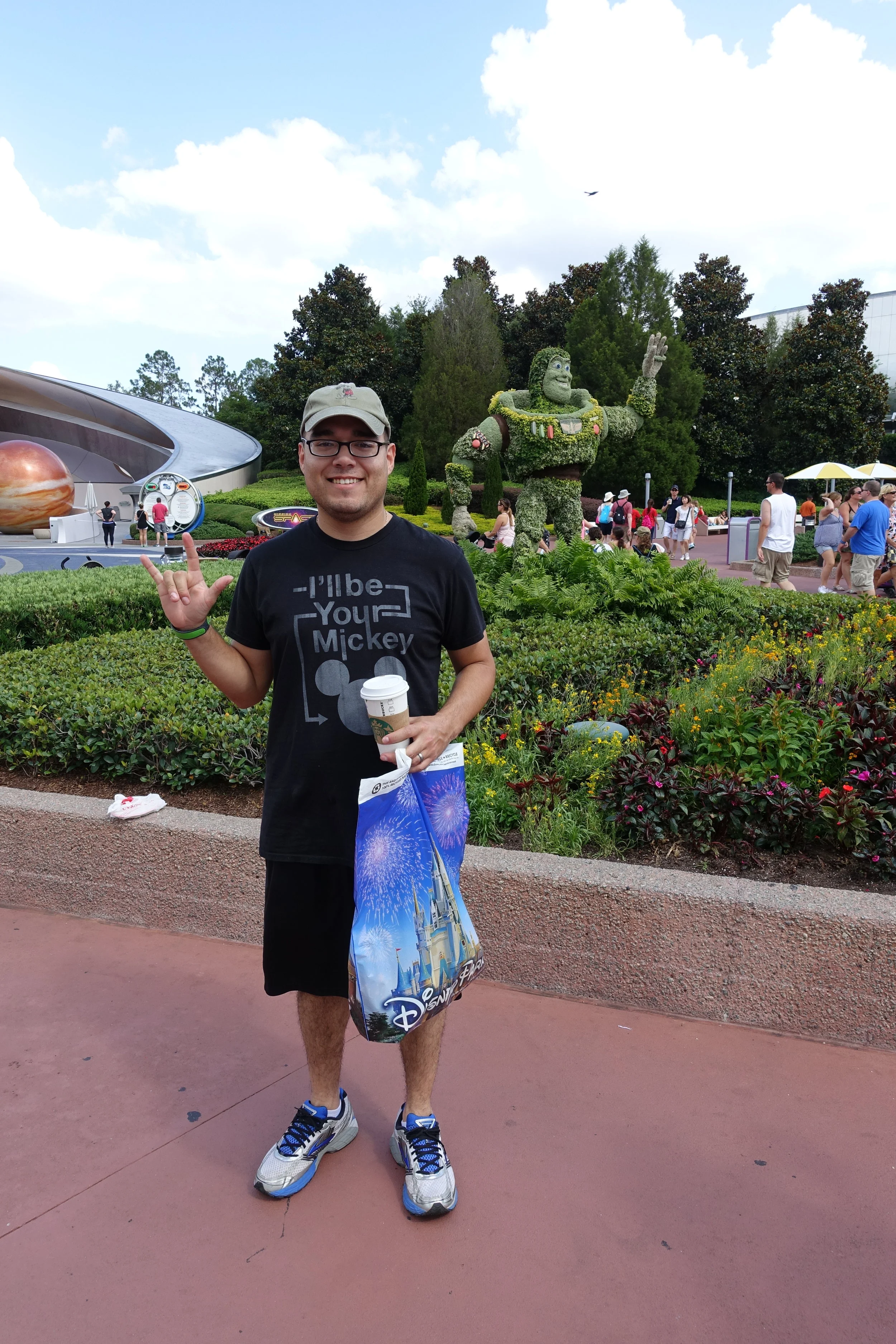 Ries with the Buzz Lightyear topiary.