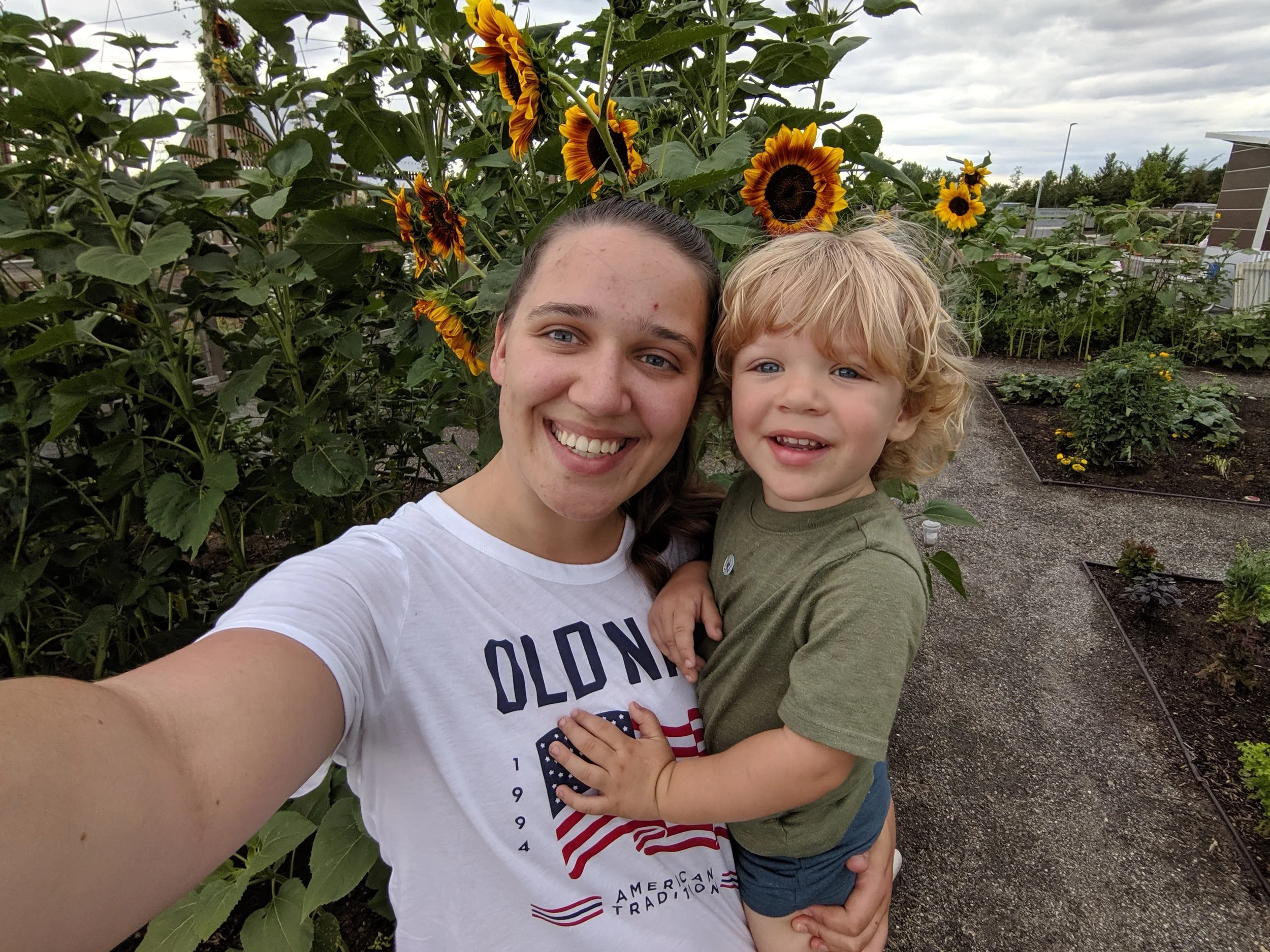 Gus and I snuck into the Community Garden at Twin Silo park in Fort Collins, Colorado to take photos with the sunflowers.