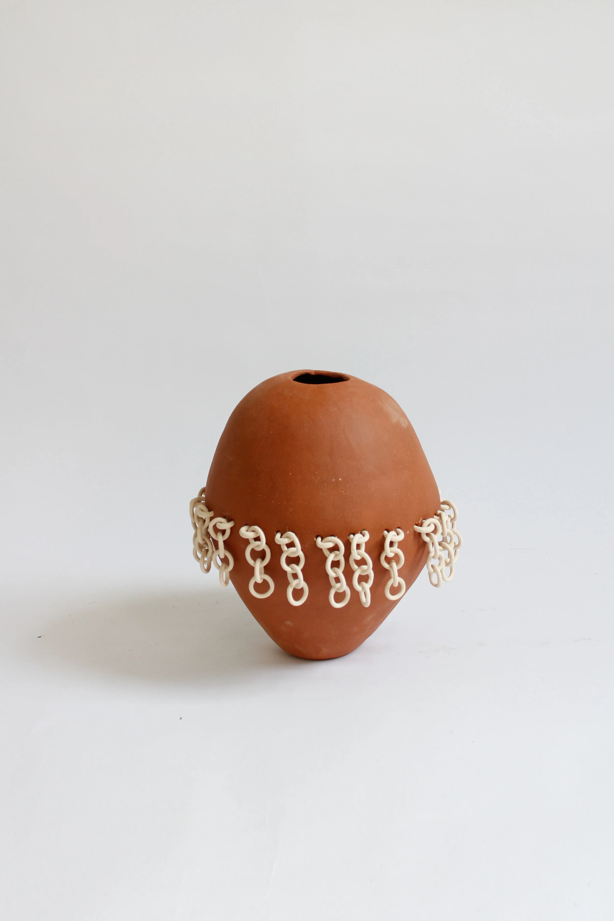 Terra Cotta Chainmail Vase Grey Background