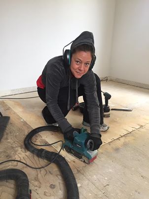  Sanding the floor smooth & level.
 