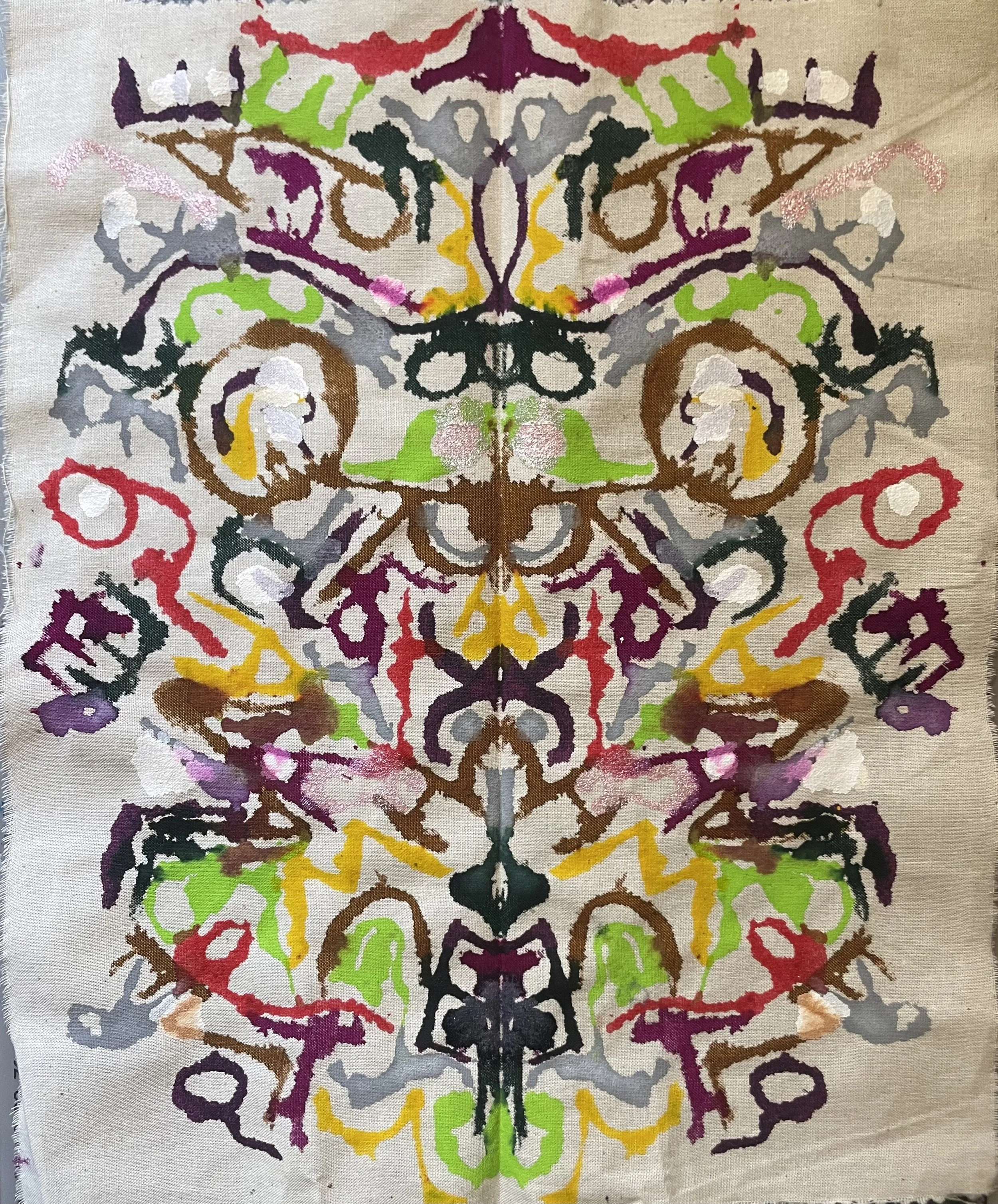 A couples' talisman made from coloured inks, words and phrases blotted to create the final unique piece