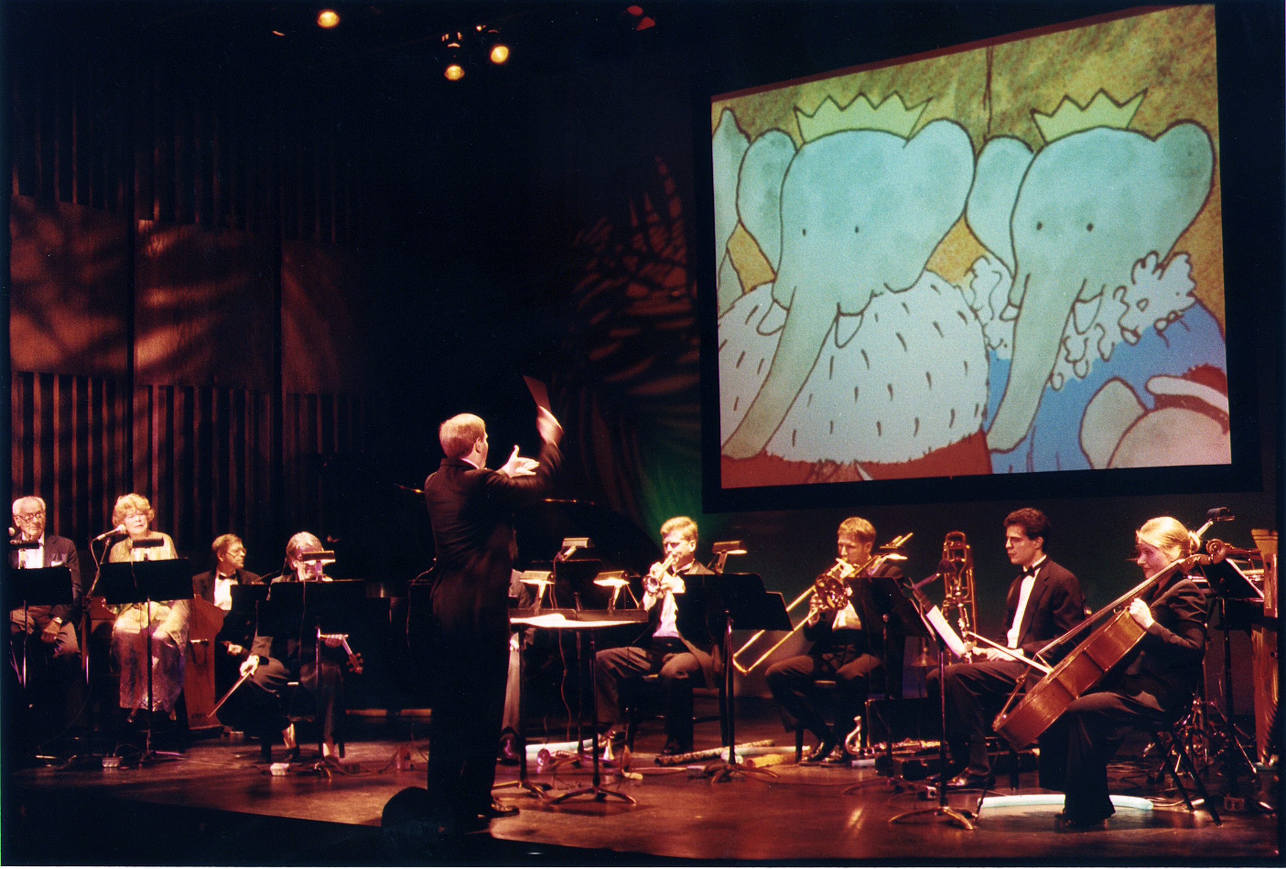 Narrators Eli Wallach & Anne Jackson, first Source Music, Inc. presetation of prior, non-HD, full Florence Gould Foundation production of Raphael Mostel’s Travels of Babar , with lighting by Michael Mazzola, Paul Hostetter conducting photo: Hiroyuki Ito