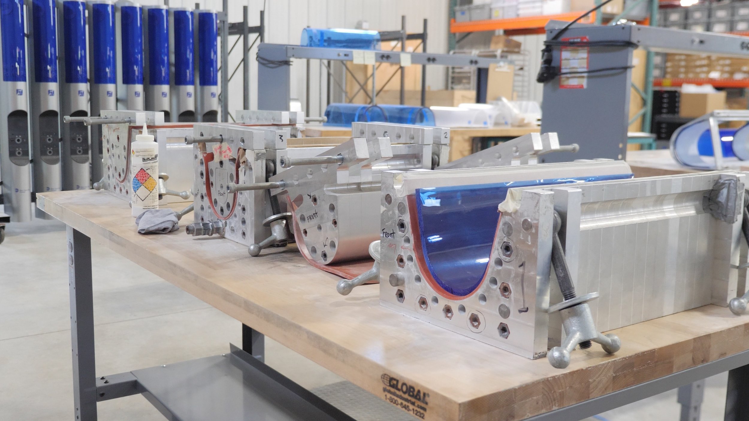 Custom molds fabricated at Boyce are used to form the sheets of blue polymer into just the right shape.
