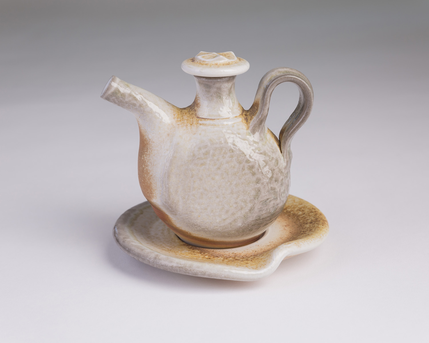 Oil ewer and saucer