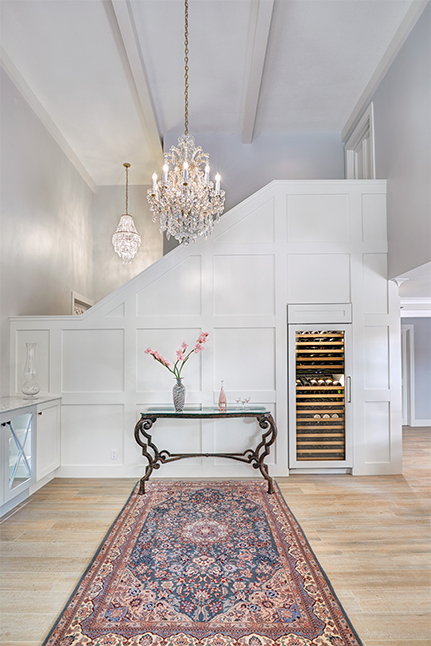 Photo, above: Ornate decor pops against the sleekly modern floors and woodwork of this space. Designer: Nar Design Group; Photographer: Fred Donham