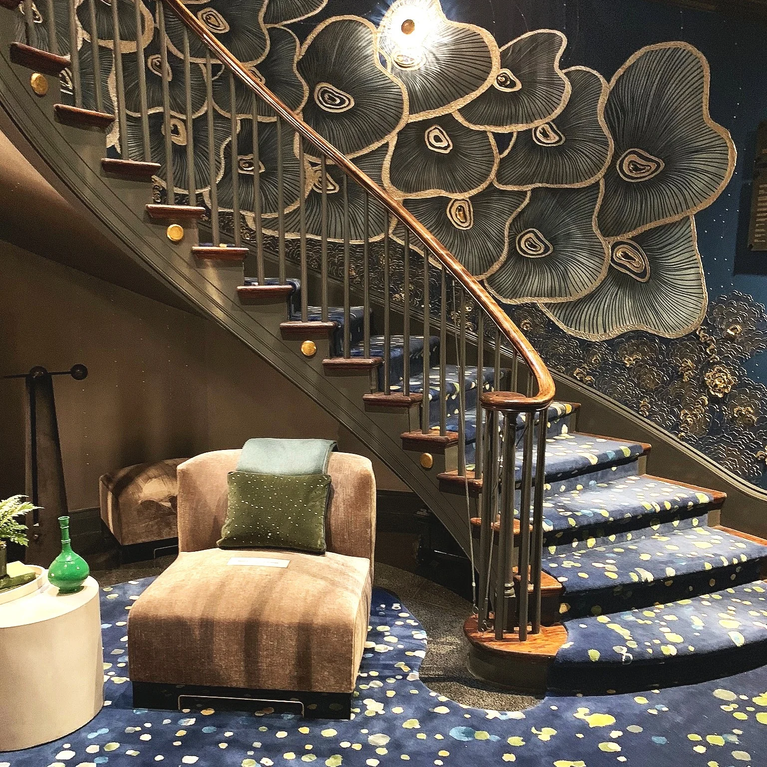 Richard Rabel Interiors and Art Ltd . Entry Gallery and Grand Lower Staircase. The rug was created without knowing that it would so perfectly echo the droplet effect created by the 4-story-spanning mobile above.