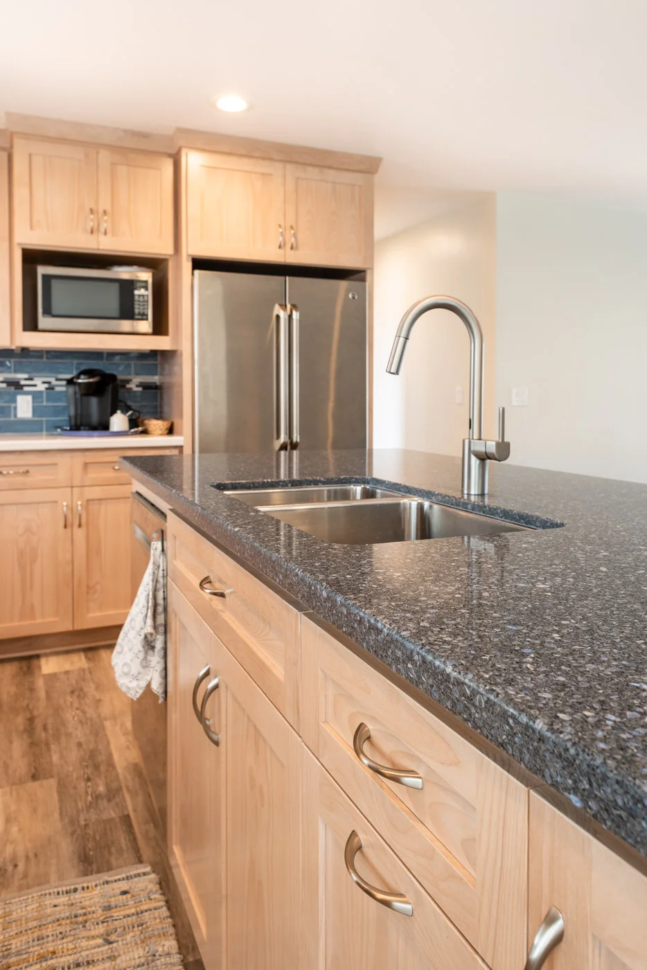Coastal Contemporary custom kitchen cabinets with natural wood stain and kitchen island sink