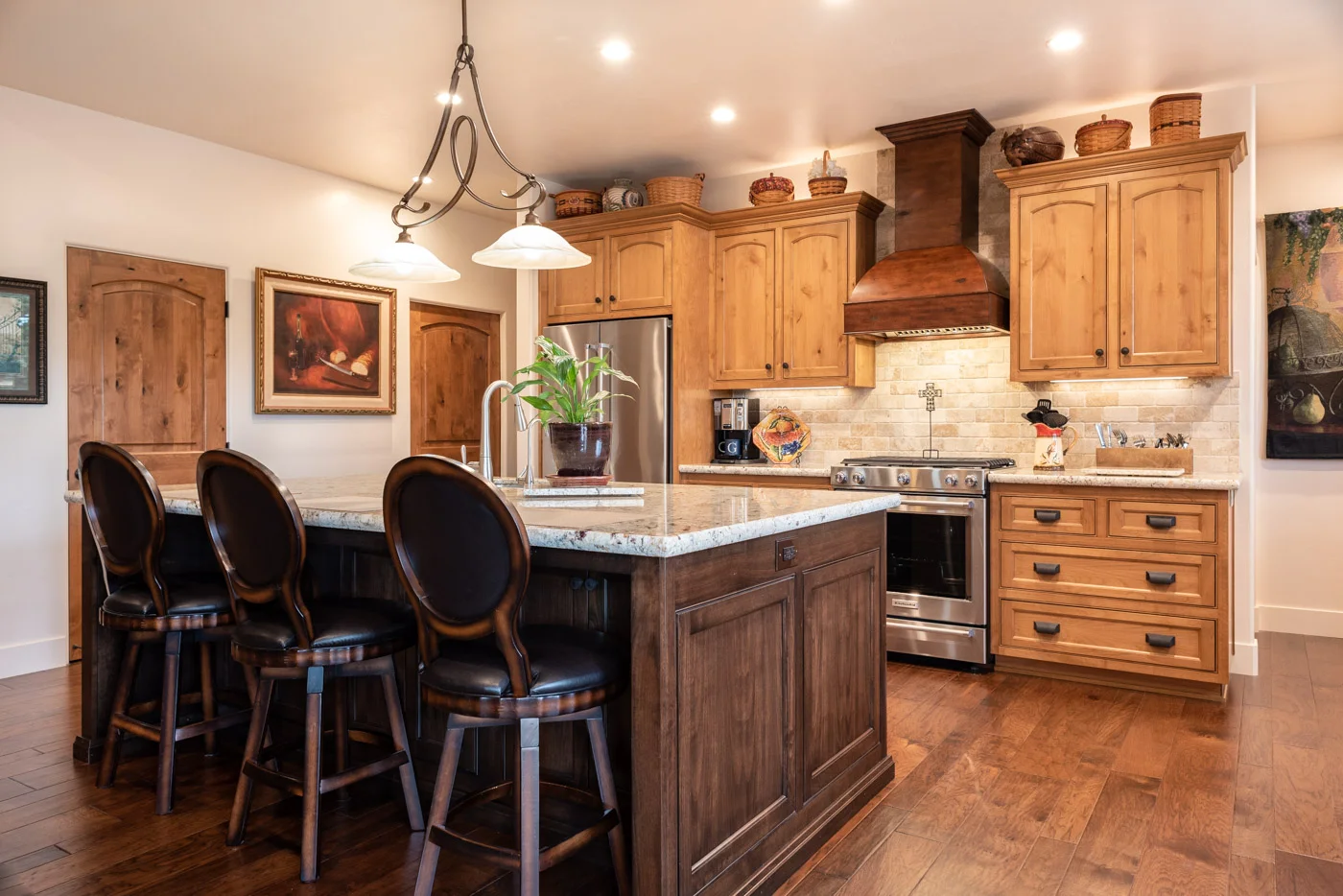 Tuscan Artisan custom stained Alder wood kitchen cabinets and island