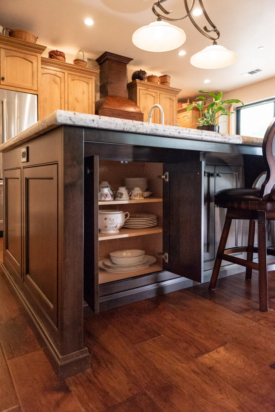 Tuscan Artisan custom stained Alder wood kitchen island storage