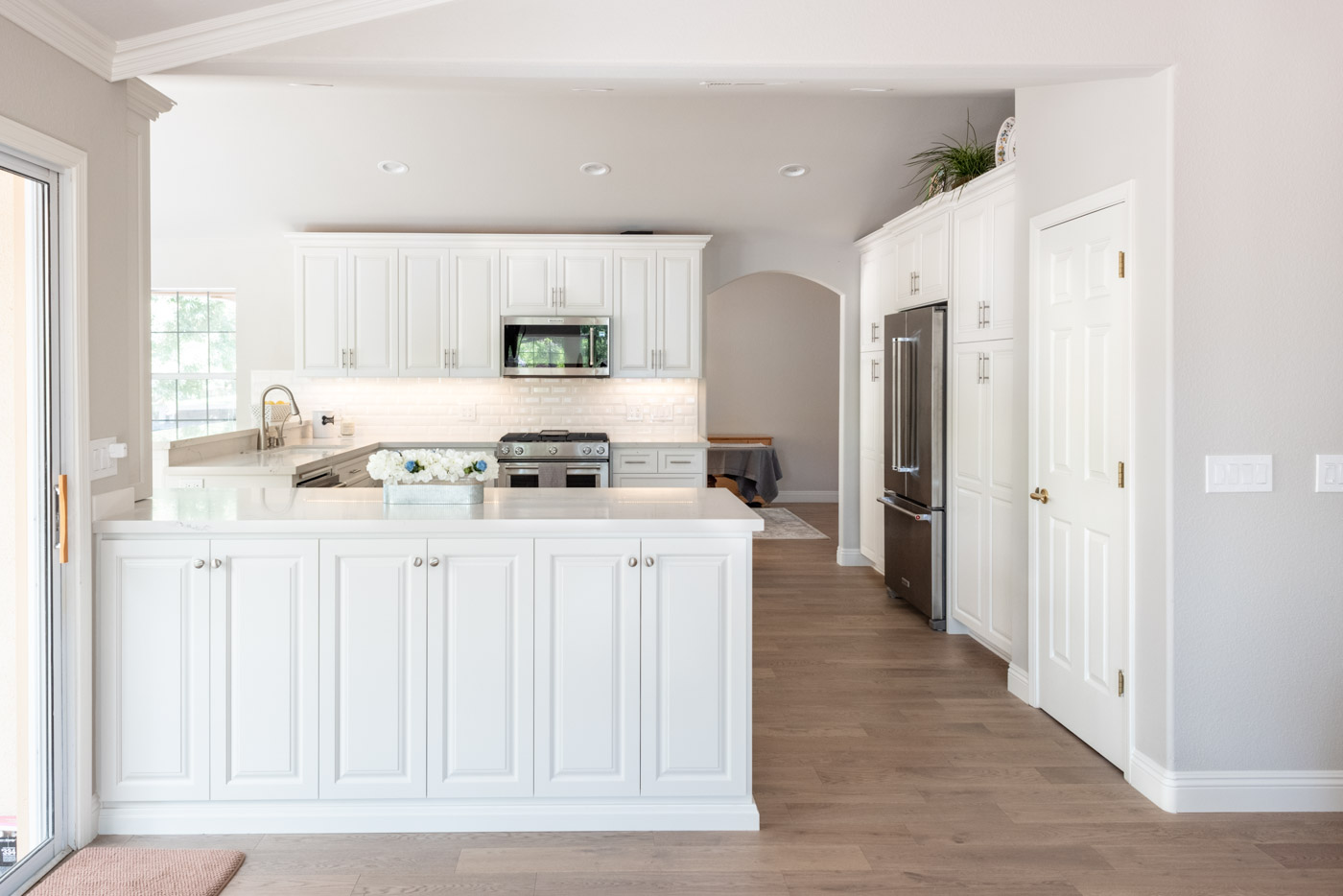 Modern Farmhouse Cottage kitchen with custom white painted cabinets
