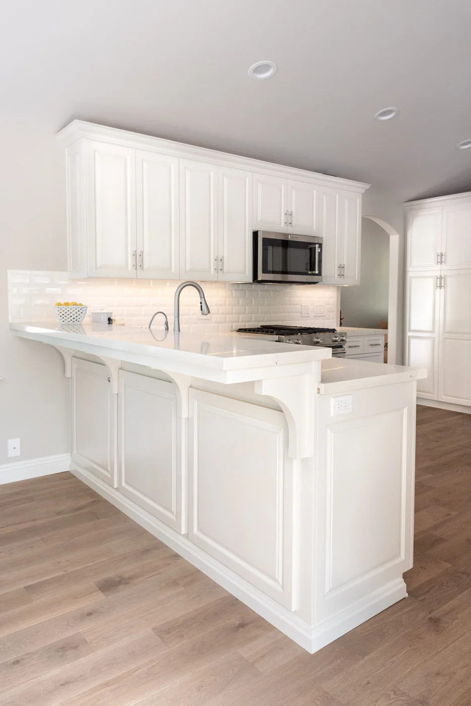 Modern Farmhouse Cottage kitchen with custom white painted cabinets