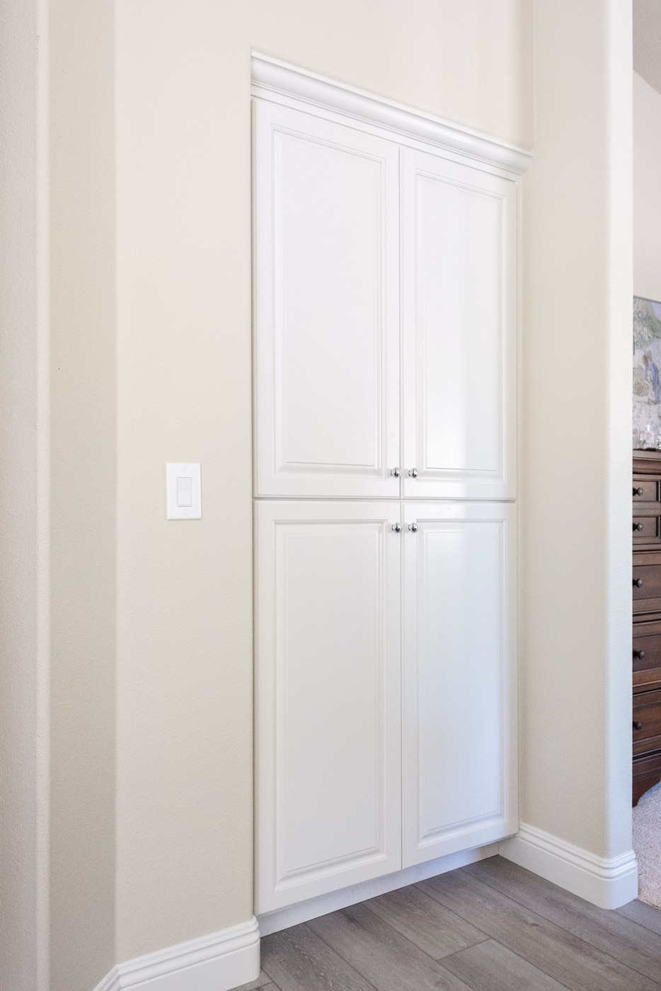 Modern Farmhouse Cottage bathroom linen closet with custom white painted cabinets