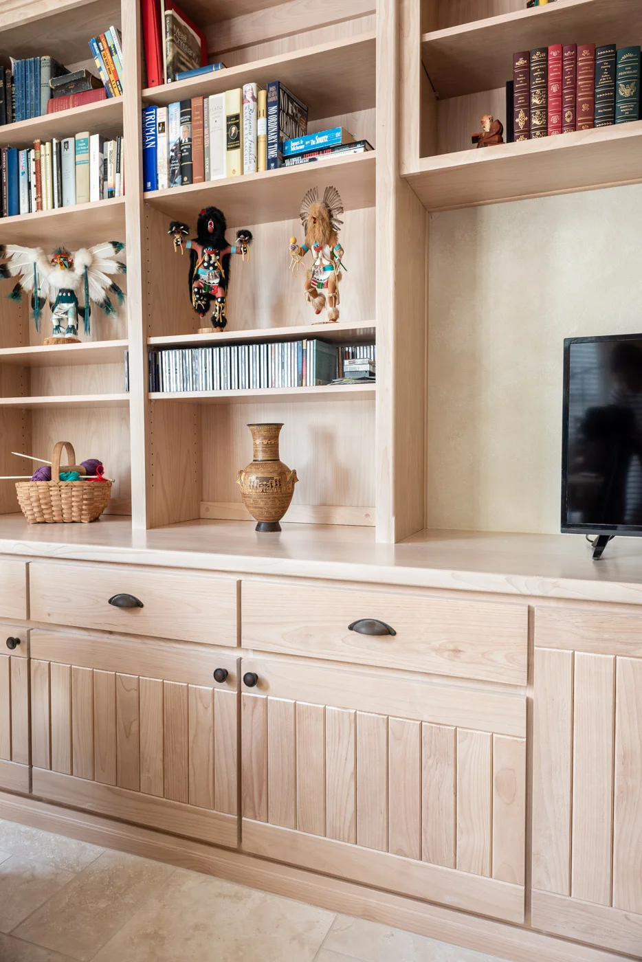 Simple Southwestern style home with custom living room built in bookcase cabinets