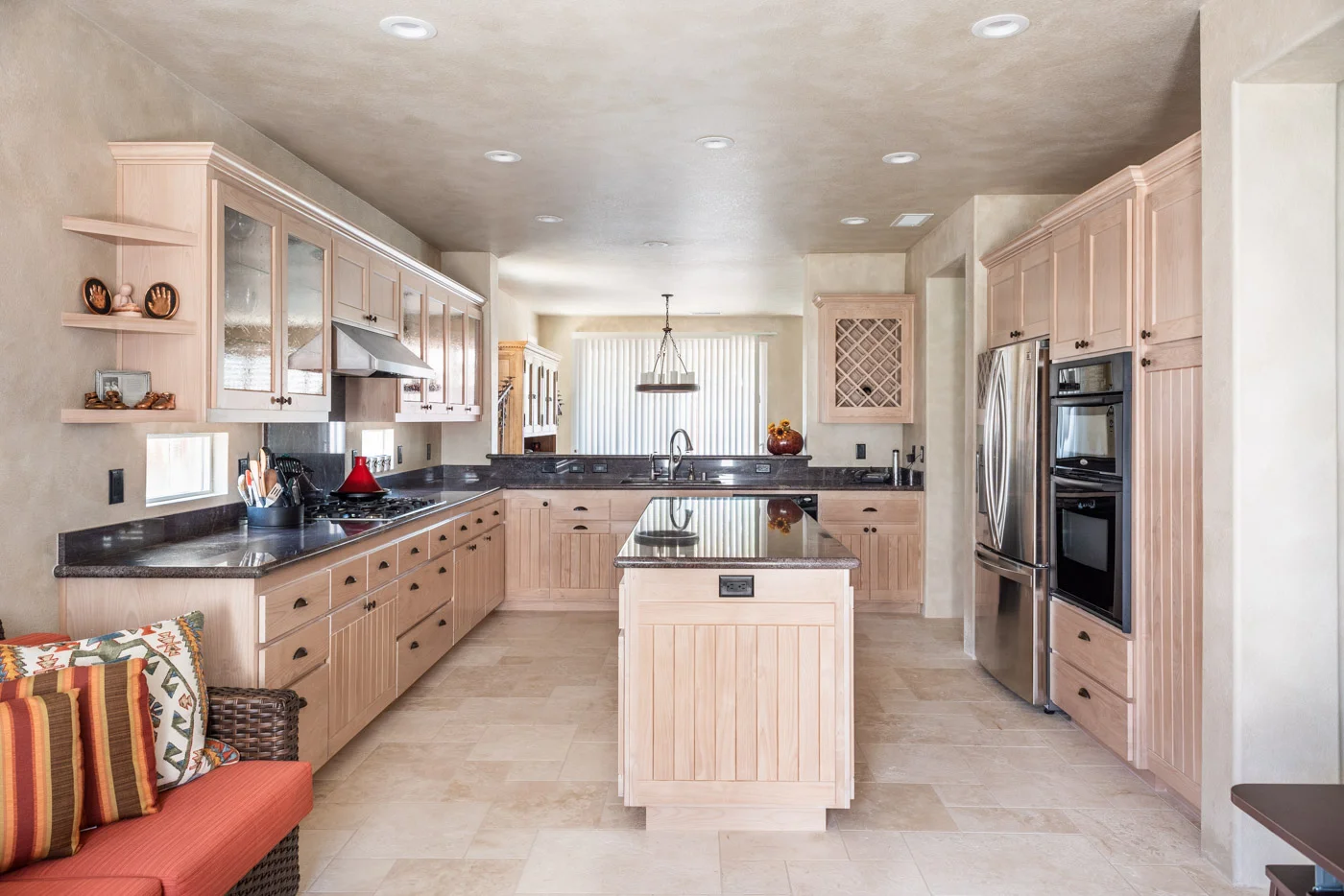 Simple Southwestern custom kitchen cabinets in white washed wood stain