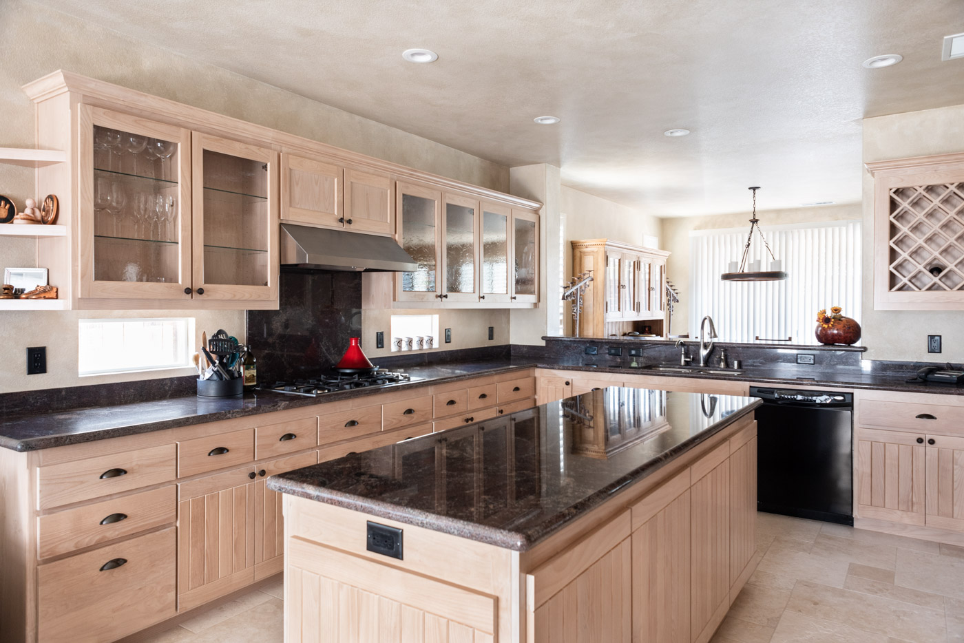Simple Southwestern custom kitchen cabinets in white washed wood stain