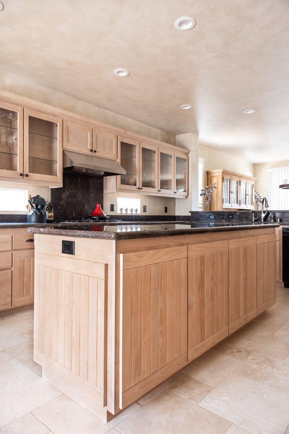 Simple Southwestern custom kitchen cabinets in white washed wood stain