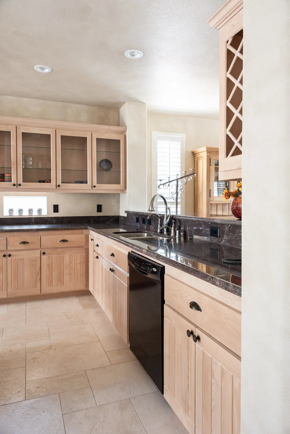 Simple Southwestern custom kitchen cabinets in white washed wood stain