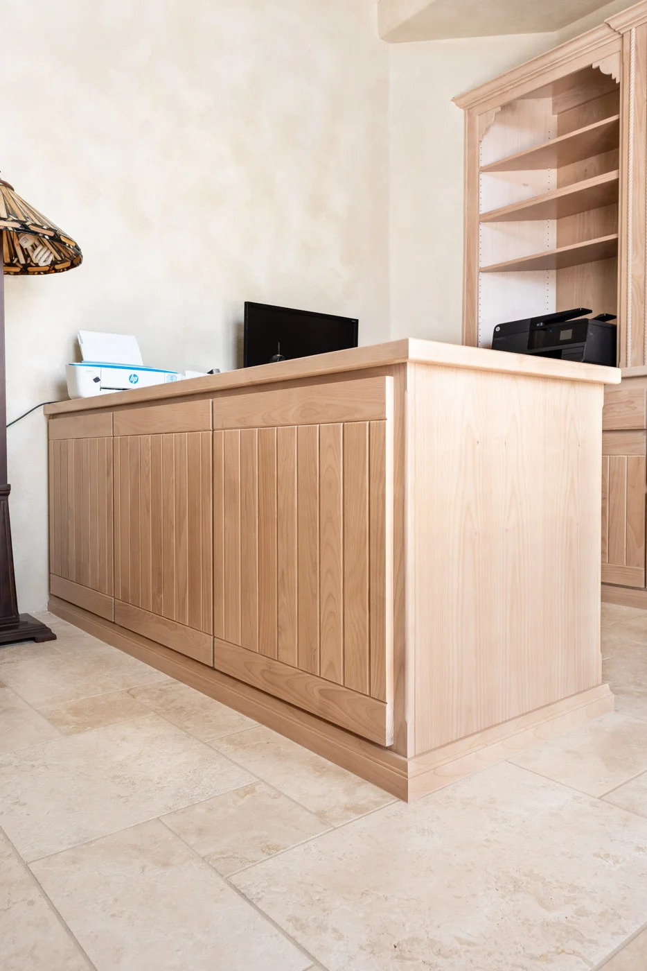 Simple Southwestern custom home office cabinets and desk in white washed wood stain