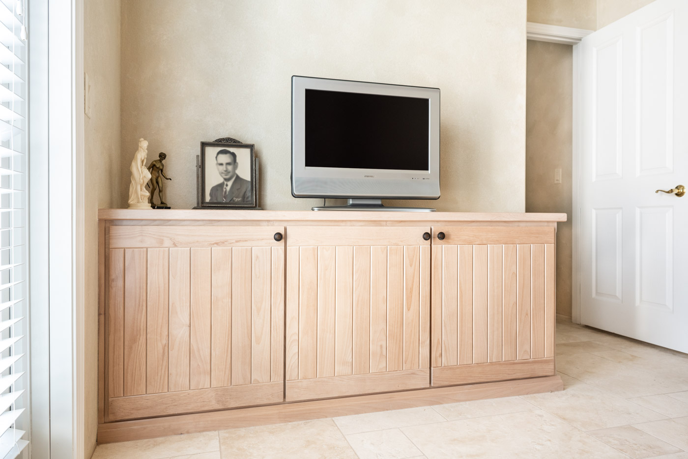 Simple Southwestern custom home office cabinets in white washed wood stain