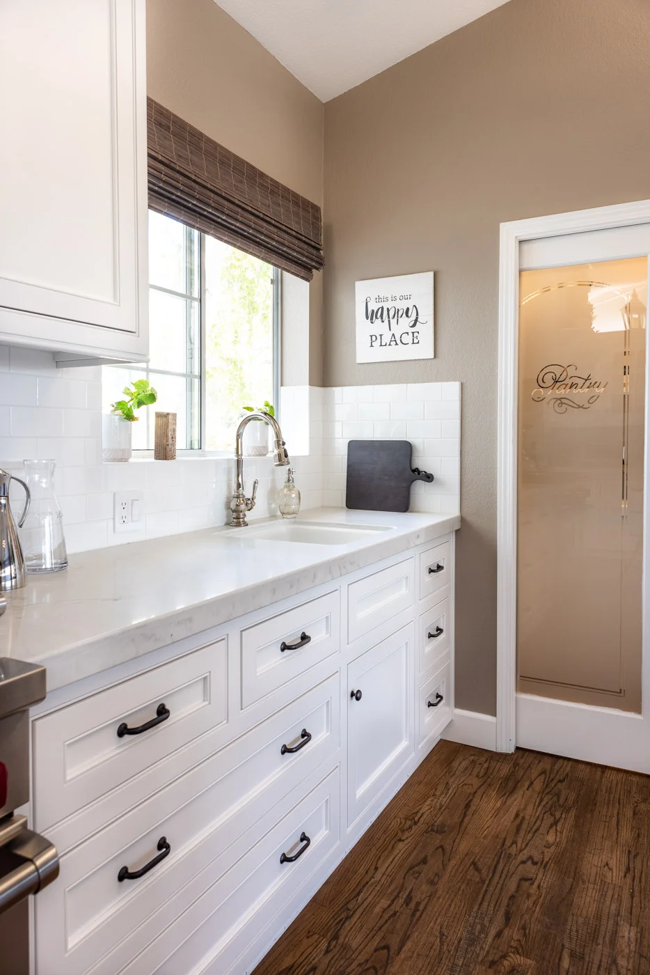 Transitional Country Cottage style kitchen with white recessed panel painted cabinets